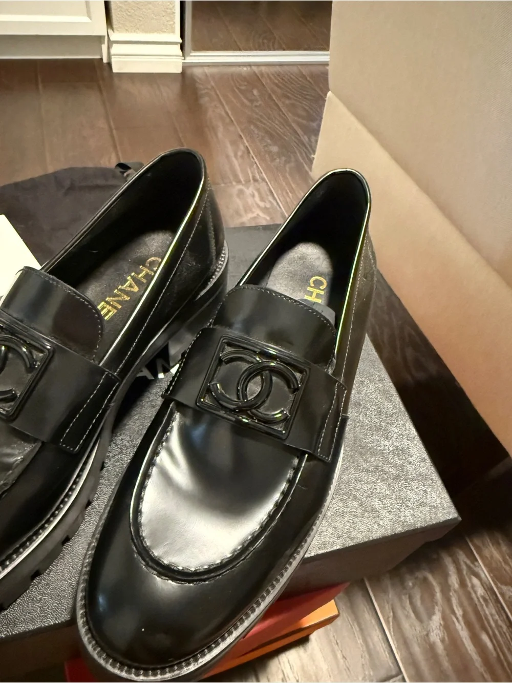 CHANEL Black on Black CC buckle loafers